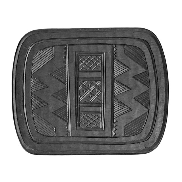 Vintage Nupe table with beautiful rich ebony black finish with traditional geometric style carvings. Matching smaller...