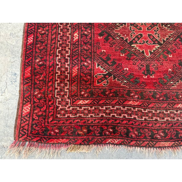 Ruby Red color Afghan tribal zahir Shahi pattern rug. It has been hand-knotted in Mazar e Sharif, Afghanistan. The soft...