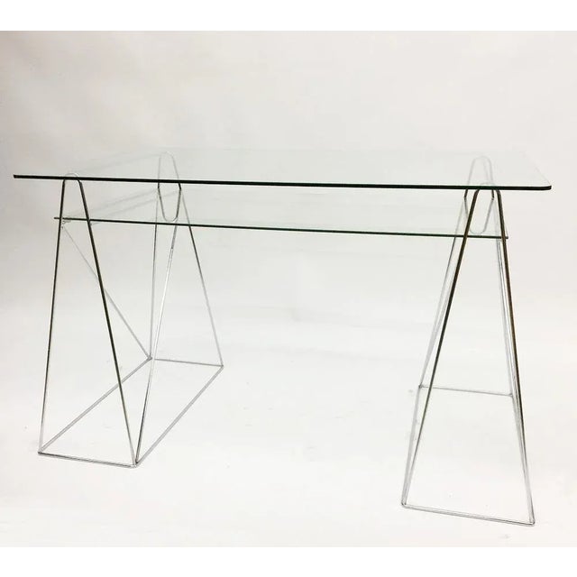 Vintage Hollywood style chrome and glass desk, 1970s Trestle leg console table/ desk with two tiered glass top The...