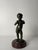 A small bronze sculpture depicting the God of Love, created between the 18th and 19th centuries by Claude Michel, also...