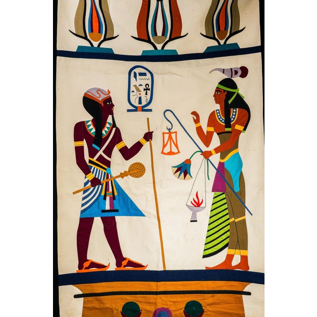 A spectacular survivor from the golden age of Egyptomania, this monumental circa 1920 Egyptian wall hanging is an...