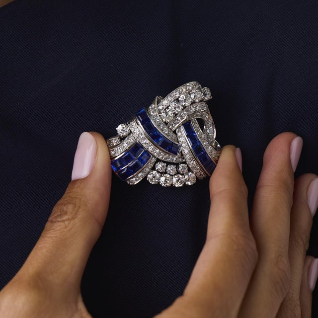 This exceptional Art Deco diamond and sapphire pendant is a refined 1930’s design, featuring 85 old European and single...