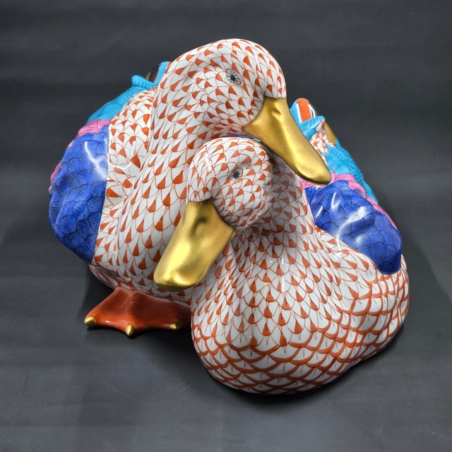This is a charming figurine of a pair of wild ducks cuddled together hand painted in Herend's fishnet or fish scale style,...
