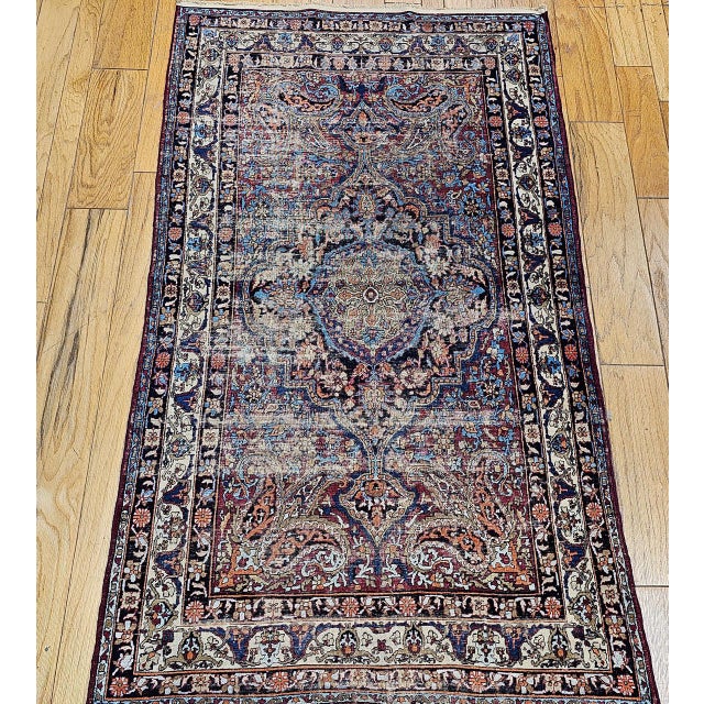 "The 19th century silk Kashan area rug features an exquisite floral and medallion design, meticulously handwoven in the...