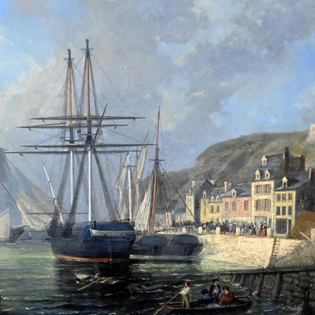 This oil on panel unfolds a visually intense port scene where majestic sailing ships stand along a bustling quay, while...