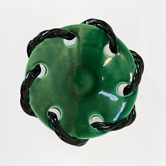 Beautiful and rare dark green ceramic centerpiece with black rope wrapped around produced by Vallarius with the brand...