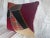 This vintage American patchwork pillow is hand-stitched from a variety of repurposed fabrics, showcasing traditional...