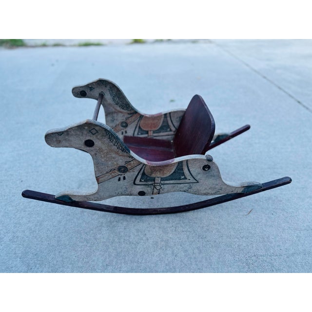 Vintage Hand-Painted Wooden Rocking Horse – Double-Sided Folk Art Toy Seat Full of rustic charm and whimsical detail, this...