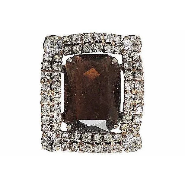 1980s goldtone open back emerald cut faux-topaz paste and round clear paste clip back earrings. Unmarked DeLizza & Elster....