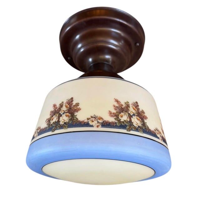 This flushmount ceiling light is perfect for any room of the house that needs charm. Painted cornflower blue with flowers...