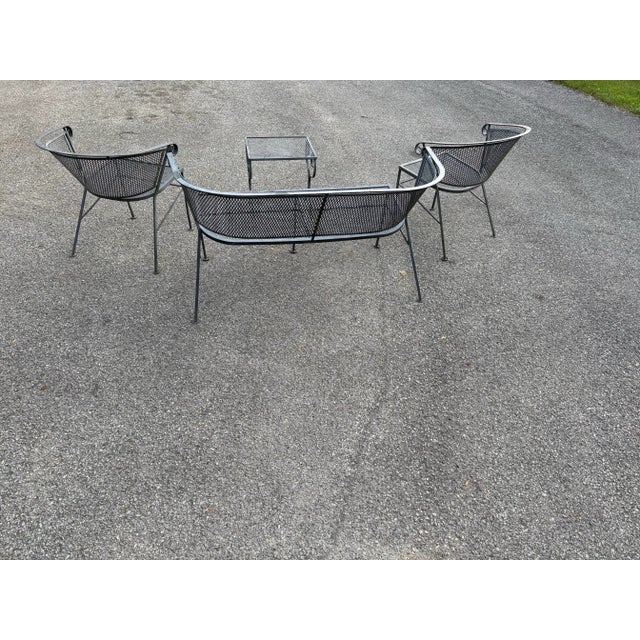 Nice set of vintage wrought iron patio furniture ready for your yard. You get two barrel back chairs, a love seat bench...