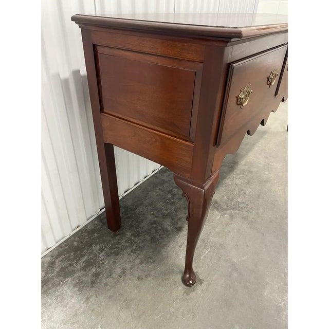 Offered is a lovely vintage Queen Anne style sideboard. This piece features three dovetailed, deep drawers. 71ʺW × 19.5ʺD...