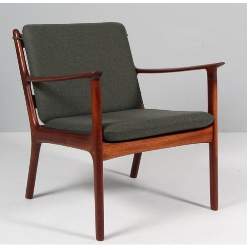 Ole Wanscher lounge chairs new upholstered in bottle green Magrethe wool. Made of solid oiled mahogany. Model PJ 112, made...