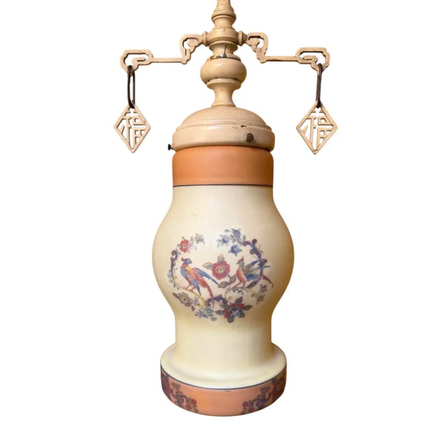 This charming hanging light is a true piece of art. Hand painted with an avian and botanical motif. The painted holder has...