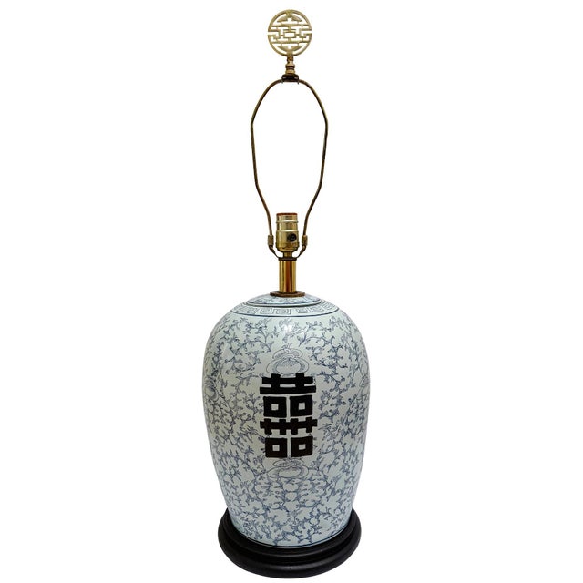 Enhance your interior with this exquisite pair of vintage Chinoiserie powder blue ginger jar lamps. Featuring a rare and...