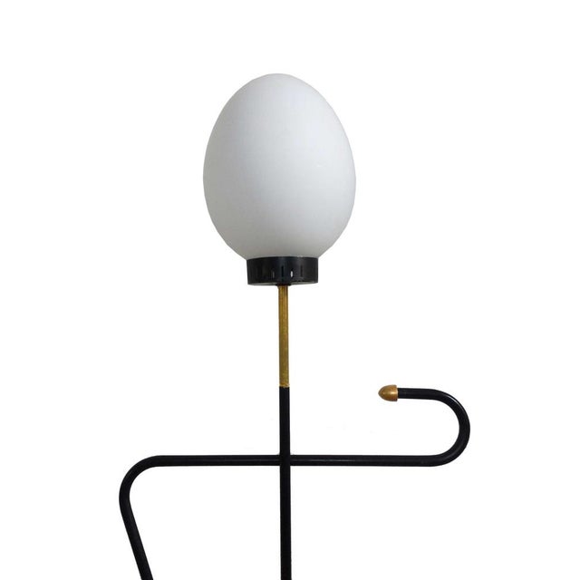 Mid-century Italian classic floor lamp in the manner of Stilnovo design style. White opaline "egg" lampshade, black cast...