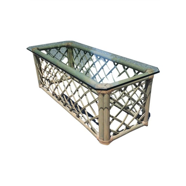 A magnificent coffee or cocktail table with Jumbo Rattan frame and glass top in excellent vintage condition. Webbed rattan...