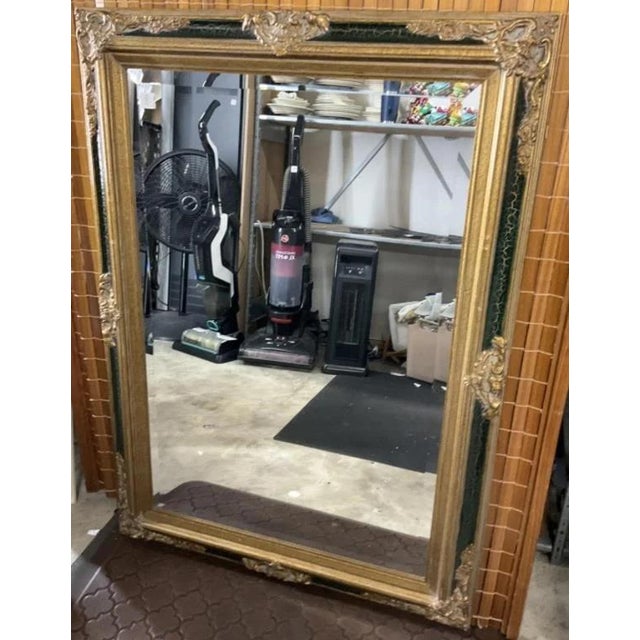 Classic Black and gold gilded wall mirror with beveled mirror glass, craqueleur paint finish and antiques gilding. Hang...