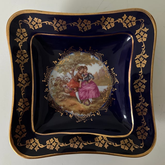 Elegant pair of vintage Limoges porcelain trinket dishes, made in France. Each square dish features a rich cobalt-blue...