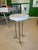 Handcrafted wooden top drink table. A heavy white wooden top with three metal legs. This table has bird feet. Table signed...