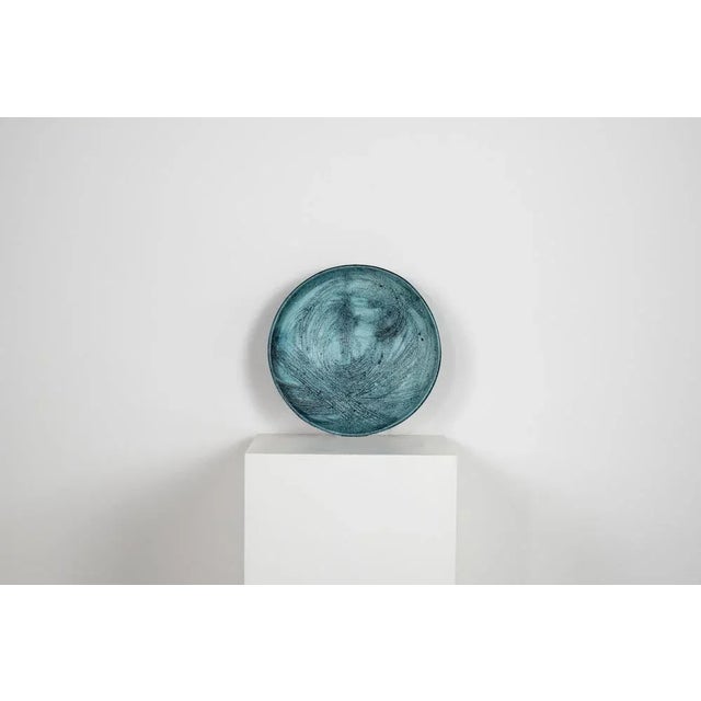 Decorative plate in ceramic realized by Giuseppe Rossicone in the 1970s. Numbered (27/120) and signed by the author. In...