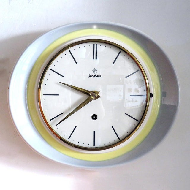 Rare, oval ceramic wall clock, attributed to Max Bill for Junghans Germany, 1950, with a Dual tone ceramic housing,...