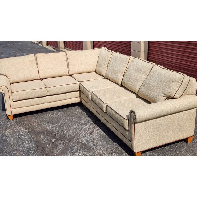 Beautiful 2 piece sectional sofa from Marshfield furniture. Sectional is upholstered in a textured beige fabric with...