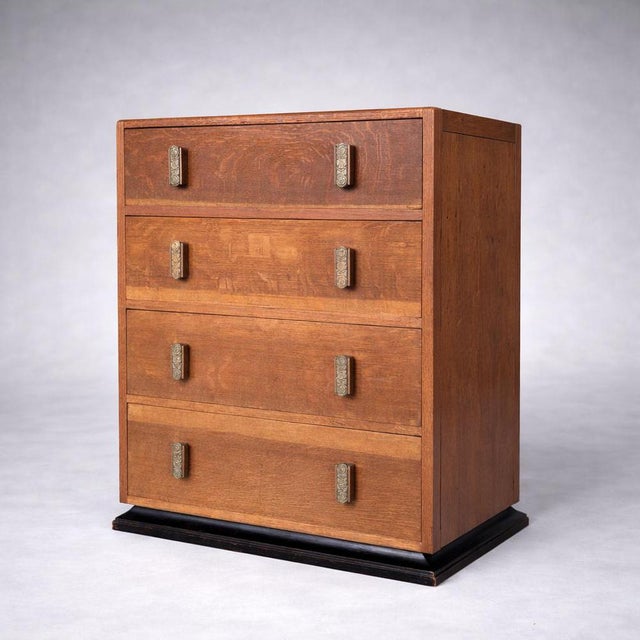 A stylish Art Deco oak chest of drawers by Heal’s, showcasing the understated elegance and quality craftsmanship for which...