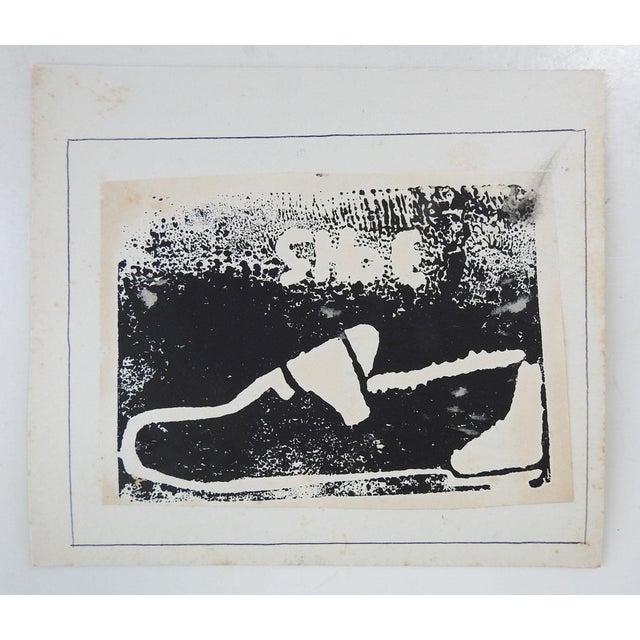 Mid 20th century lino block print of a package of shoe. Black on light cream paper. Unsigned. Unframed, mounted on...