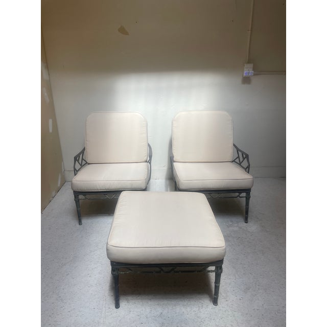 This is a 3-piece outdoor lounge set, which includes two lounge chairs plus an ottoman. The set is attributed to Brown...