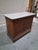 A handsome 19th-century French walnut commode featuring a substantial white marble top and beautifully figured bookmatched...