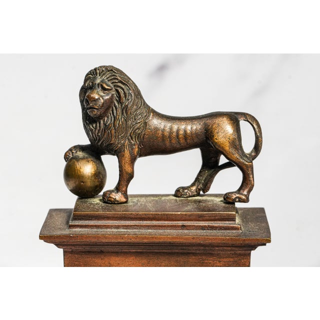 A handsome and historically significant Grand Tour souvenir, this heavy, thick brass model depicts the famed Butte de Lion...