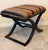Add a sophisticated architectural statement to your space with this authentic, discontinued Port 68 Curule X-Bench....