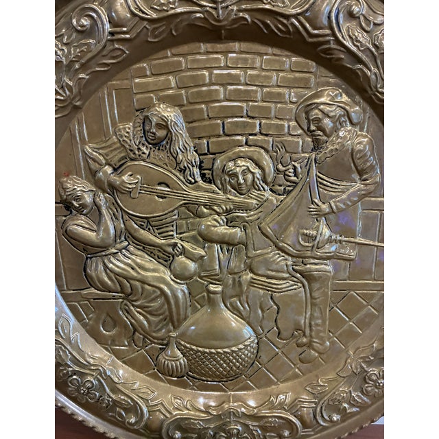 A wonderful example of traditional English brassware, this large embossed brass decorative plate is one of those rare...