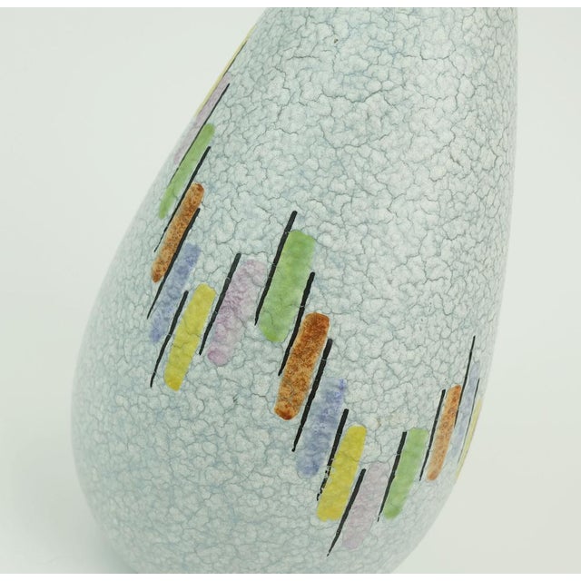 Beautifulmid-century ceramic vase manufactured by Steuler-Keramik. Drip glaze in light blue and white combined with a...