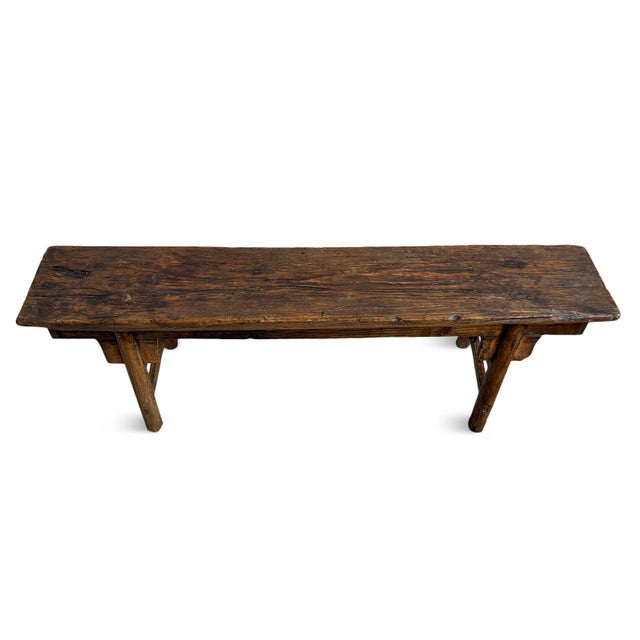Vintage elm wood village bench with rich dark stained finish. Traditional carved details and design. Can be used indoors...