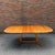 Danish Modern dining set featuring a solid teak dining table paired with four Model 85 dining chairs designed by Niels...