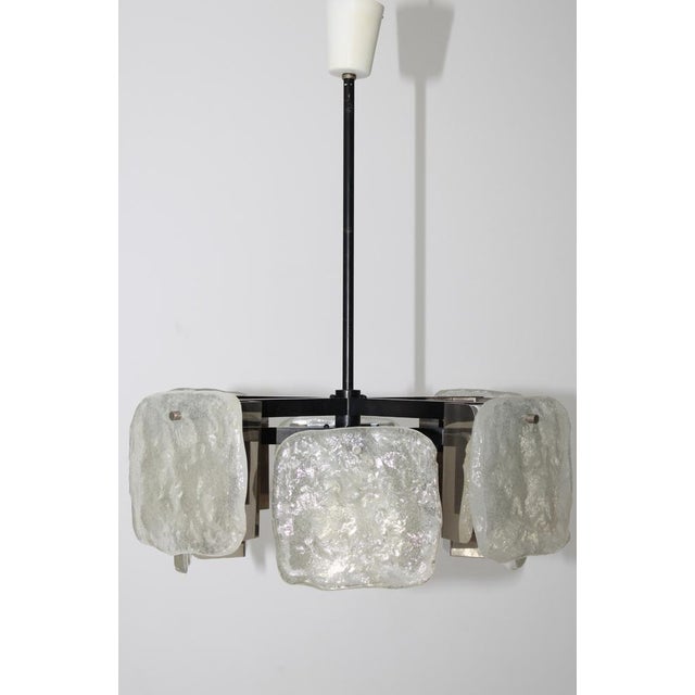 Kronleuchter from Kalmar, "Karlstein" model, glass hanging: 8 square glass panels made of cast dispersion glass, 16 Flame...