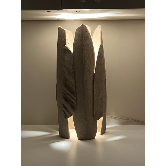 A sculptural ceramic table lamp inspired by the organic forms of nature. Handmade in stoneware, Henri combines a strong,...