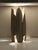 A sculptural ceramic table lamp inspired by the organic forms of nature. Handmade in stoneware, Henri combines a strong,...