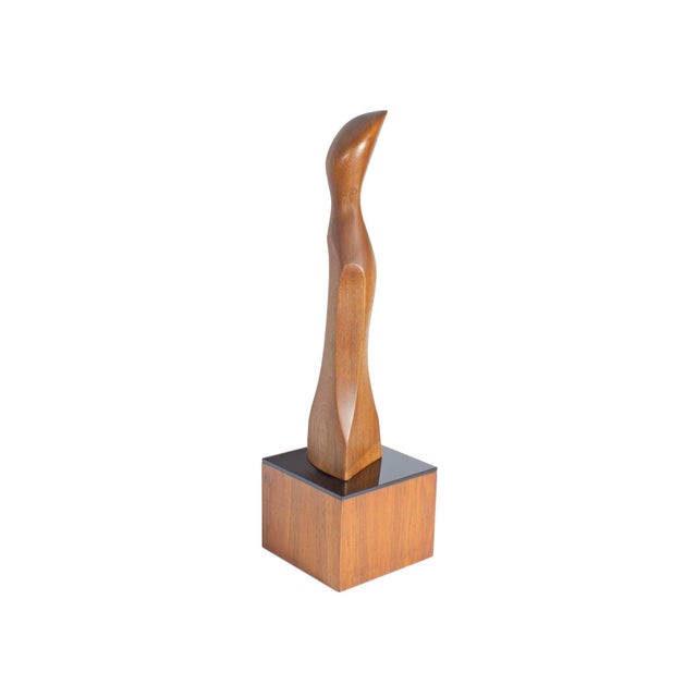 A 1972 abstract wood sculpture by the Italian-American sculptor Alfredo Burlini (1910-2006). This sculpture features an...