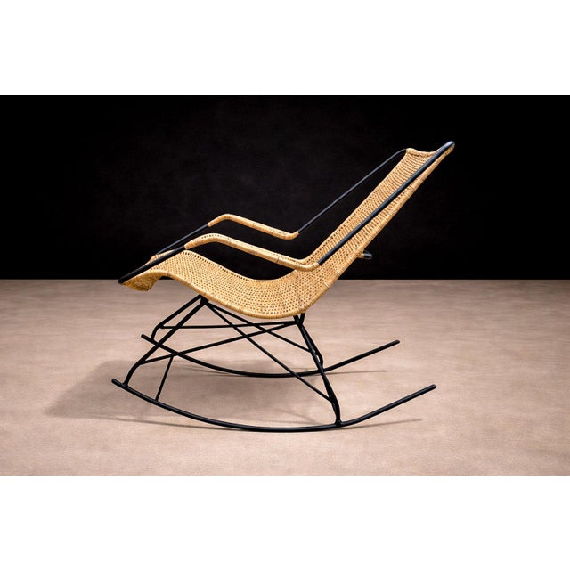 Carlo Hauner, Brazil, c. 1950s. This rocking chair reframes Hauner’s interest in lightweight structure and organic line as...