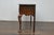 An English Georgian style two-toned oak server from the 19th century with drawers, carved apron and cabriole legs. This...