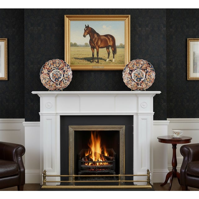 A gorgeous monumental oversized pair of antique 19th-Century Japanese Meiji Period Imari porcelain chargers with hand...