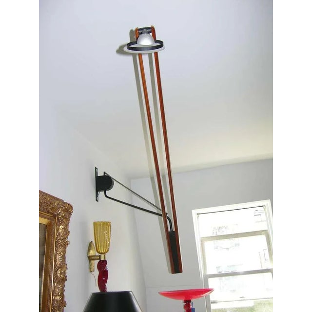 Very unusual Italian architectural wall lamp with very high tech design and clean lines, consisting of a very long...