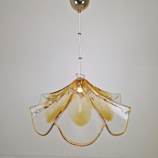 An impressive and elegant murano glass pendant lamp by la murrina, crafted in italy during the 1980s. this sculptural...