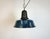 Industrial blue enamel pendant light made in Poland during the 1960s. White enamel inside the shade. Cast iron top. The...
