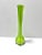 A striking 1980s hand-blown art glass vase in a vibrant green tone with black accents. The elongated silhouette and...