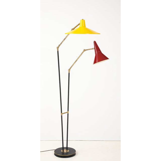 Amazing 1960's mid- century modern brass and iron with enamel shades adjustable floor lamp in the style of Stilnovo, in...