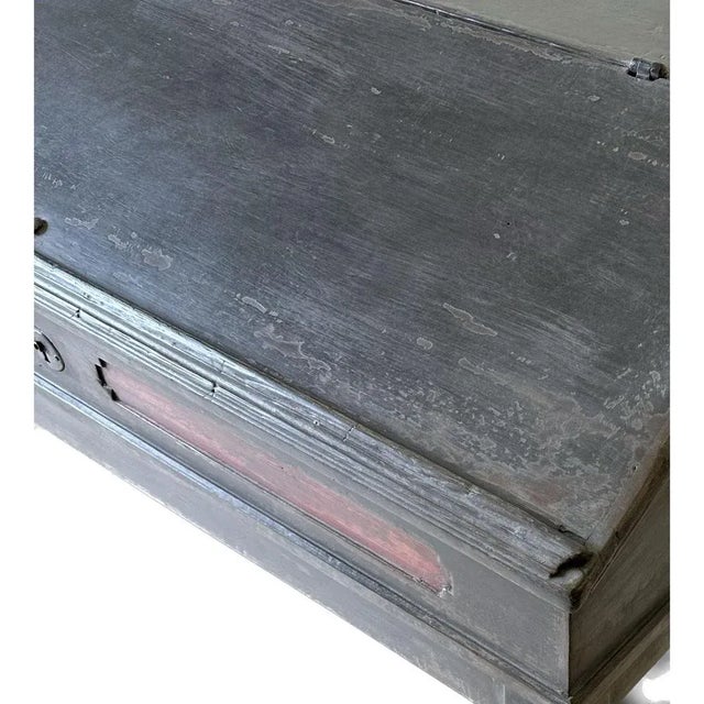 Anthracite-coloured lectern/desk with sloping flap and shelf between the straight square legs. The interior is painted red...